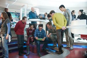 (From left to right) Simon Pegg, Zoe Saldana, J.J. Abrams, Chris Pine, Karl Urban, Anton Yelchin, and John Cho on the set of STAR TREK INTO DARKNESS from Paramount Pictures and Skydance Productions.